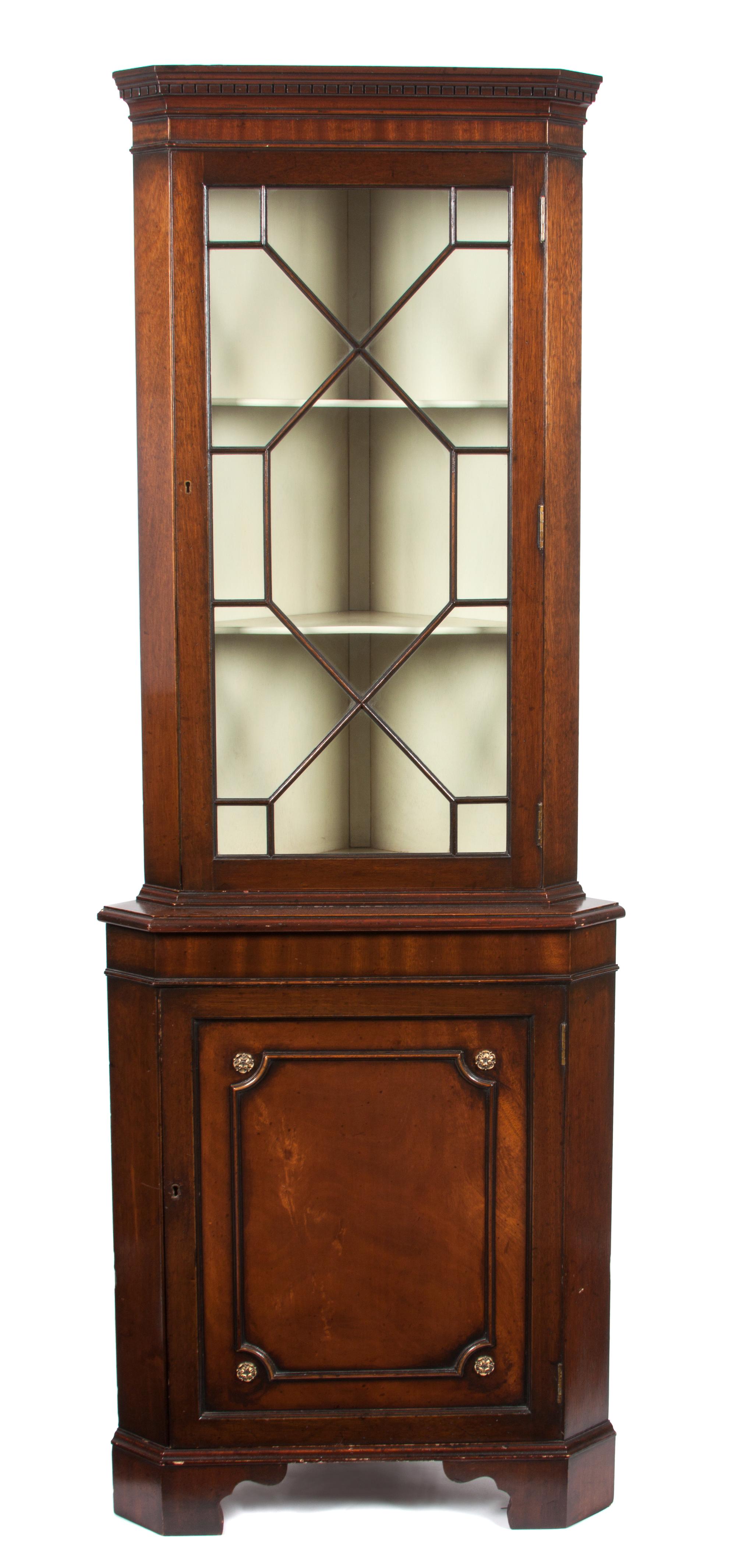 A Chippendale Style Mahogany Corner Cabinet Height 71 1/4 x width 25 1/2 inches.