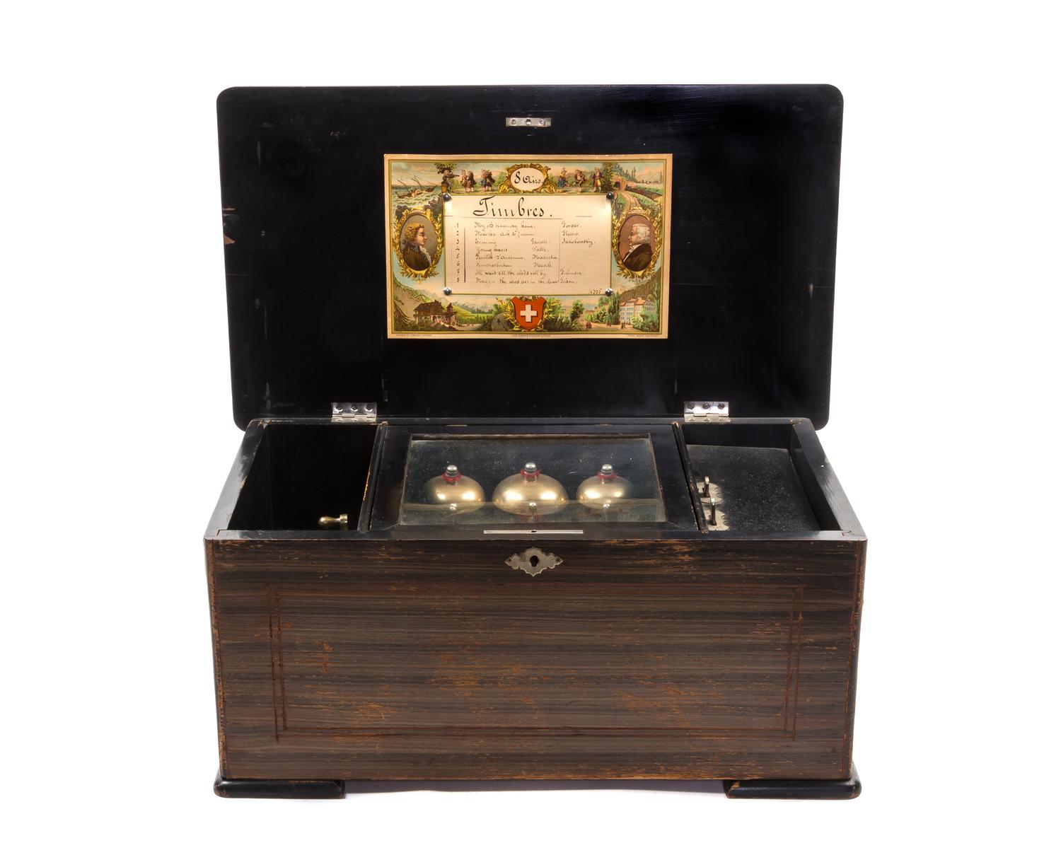 A Swiss Cylinder Music Box, Height 8 1/2 x width 19 1/2 x depth 11 inches.