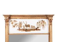 A Classical Giltwood and Eglomise Panel Inset Looking Glass