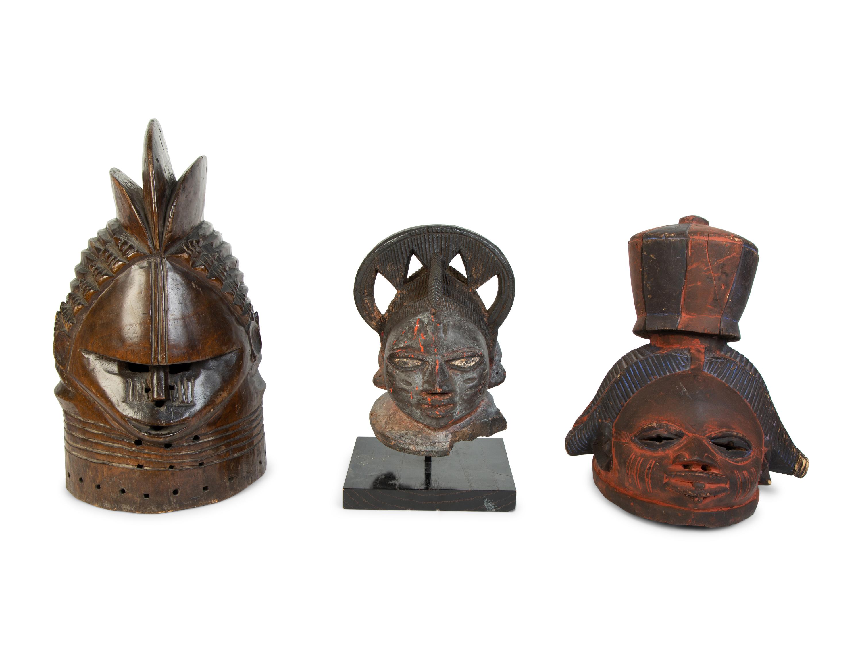 A Group of Three Helmet Masks from Tribes of West Africa — 20TH CENTURY