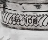 Two Pairs of English Silver Mounted Cut Glass Bottles