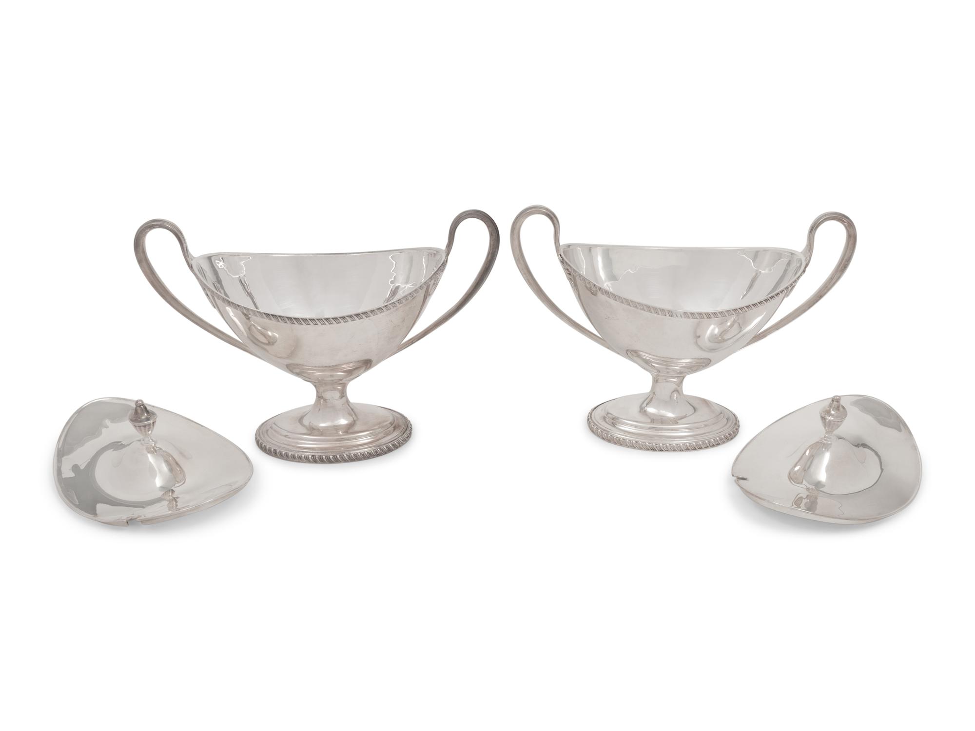A Pair of Silver-Plate Sauce Tureens and Two Silver-Plate Warmers