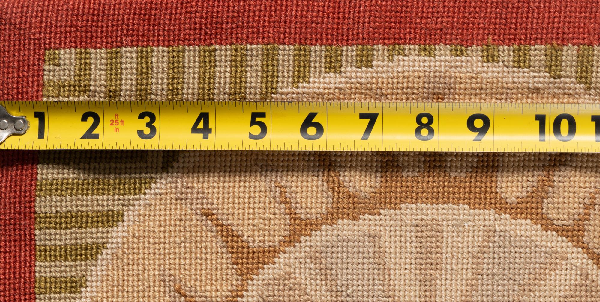 A Portuguese Needlepoint Rug