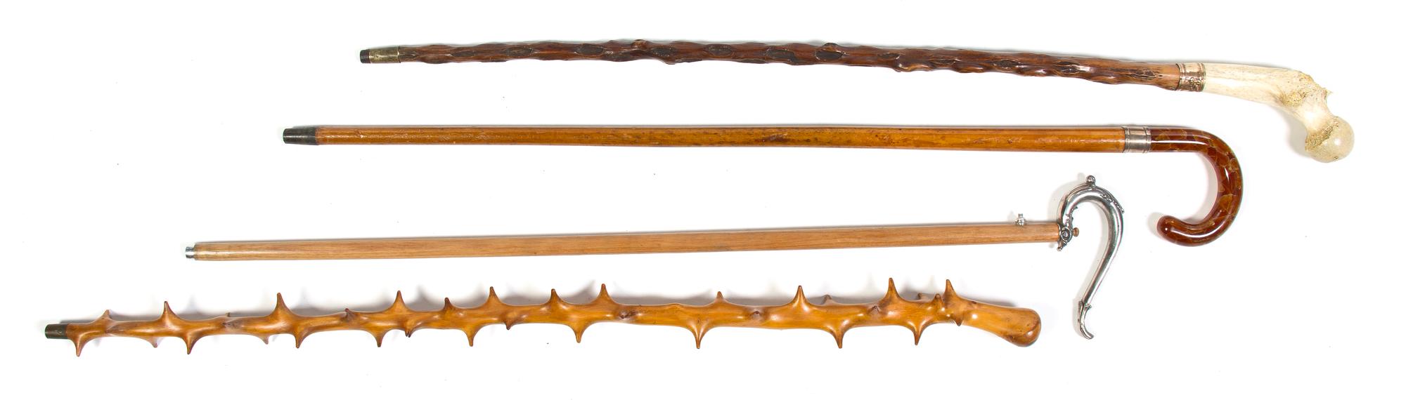 A Collection of Three Canes, Height of tallest overall 36 1/4 inches.