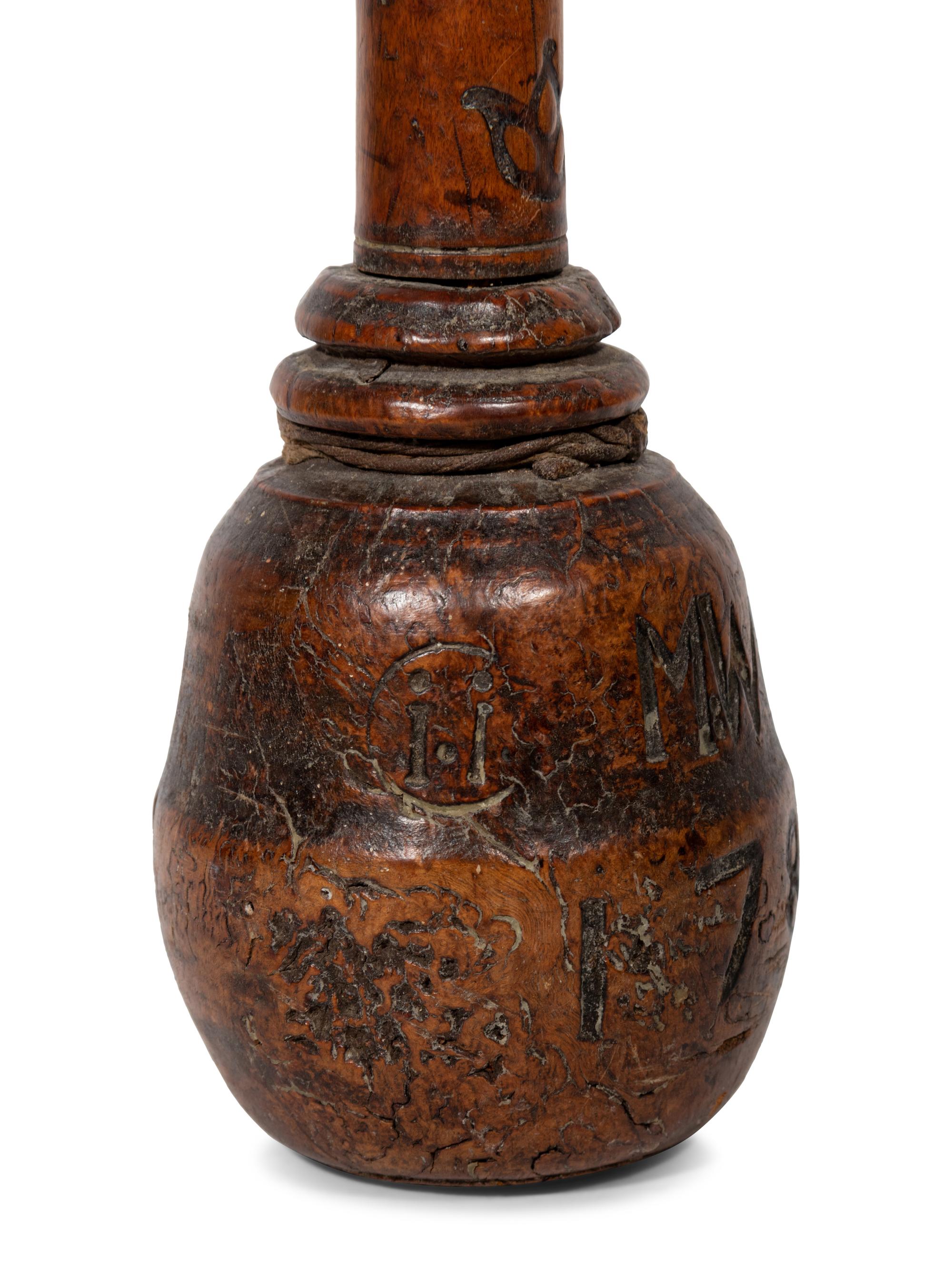 A Continental Carved Wood Pestle