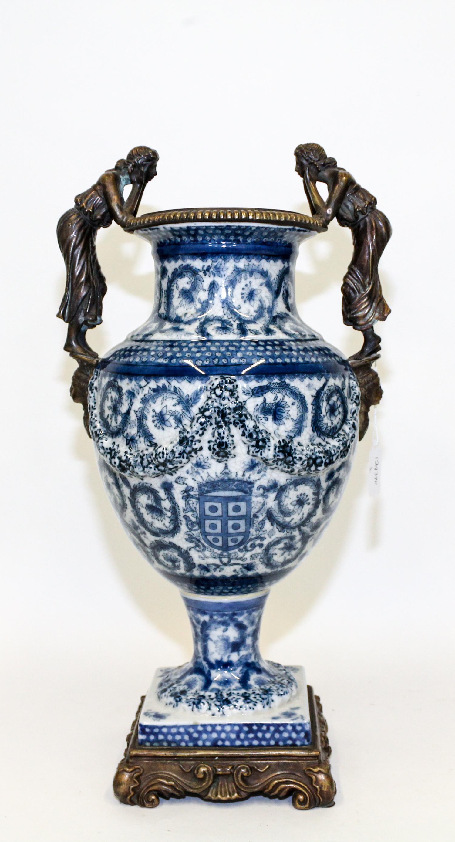 A Gilt Metal Mounted Blue and White Porcelain Vase. Height 19 inches.