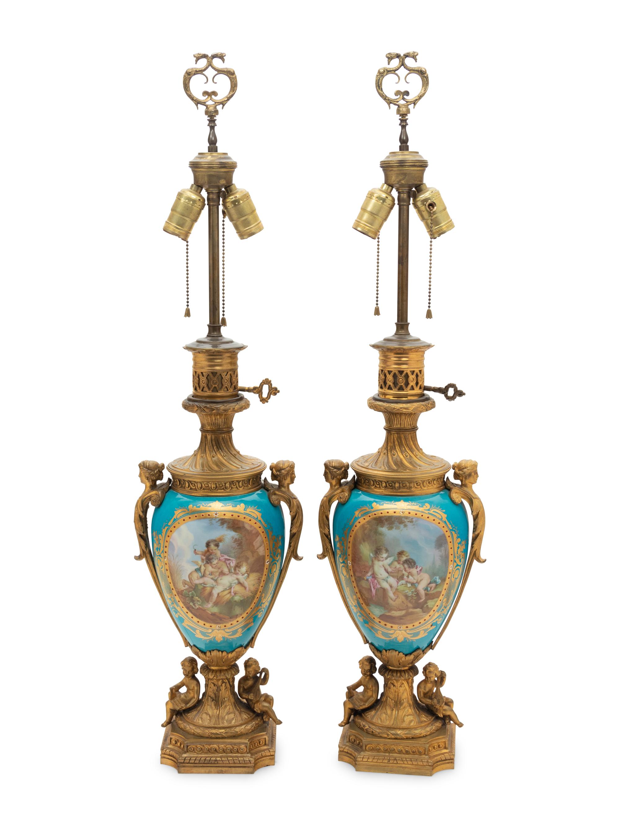 A Pair of Sèvres Style Gilt Bronze Mounted "Jeweled" Porcelain Fluid Lamps