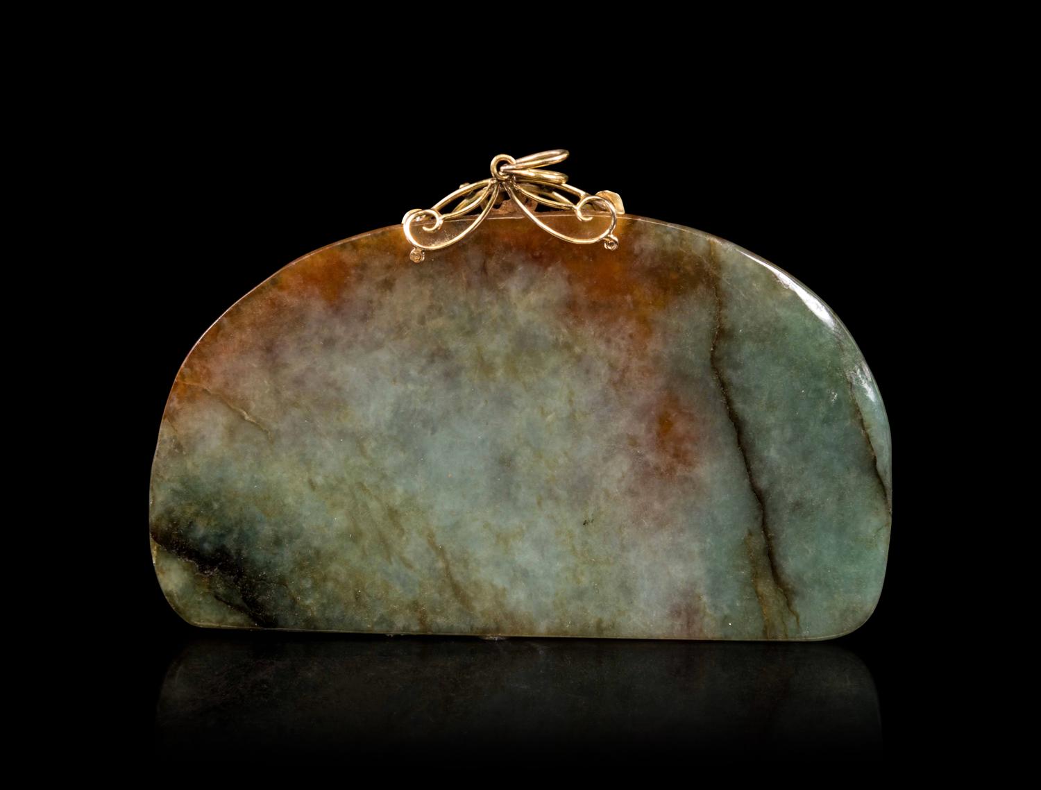 A Celadon and Russet Jade Pendant
