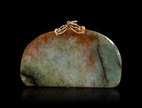 A Celadon and Russet Jade Pendant