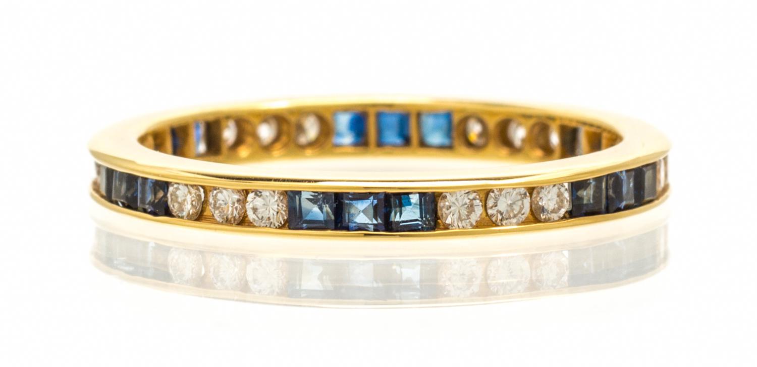 A 14 Karat Yellow Gold Diamond and Sapphire Ring Eternity Ring, 1.30 dwts.