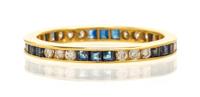 A 14 Karat Yellow Gold Diamond and Sapphire Ring Eternity Ring, 1.30 dwts.