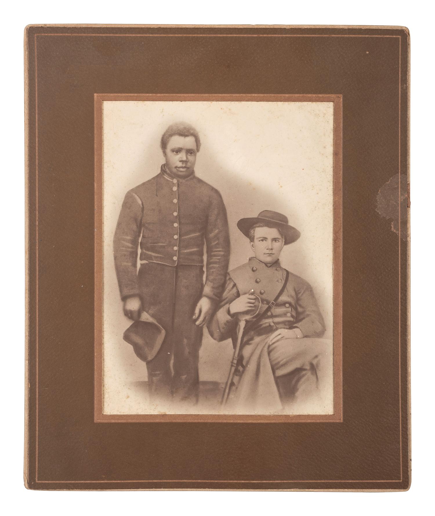 [AFRICAN AMERICANA] -- [CIVIL WAR]. Portrait of CSA Lieutenant J. Wallace Comer, 57th Alabama Infantry, with enslaved African American Burrell. Ca 1900.