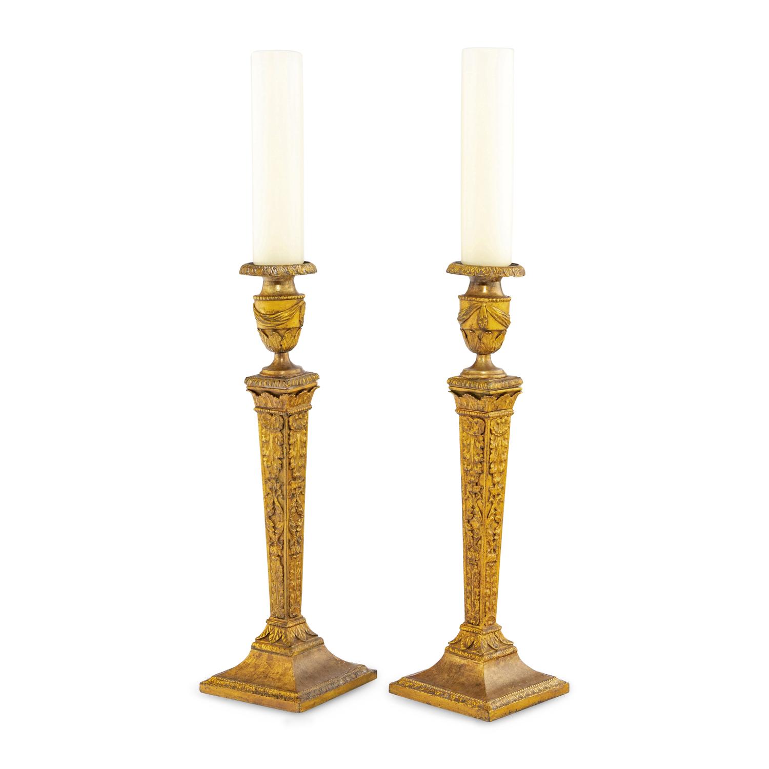 A Pair of Continental Gilt Iron Candlesticks