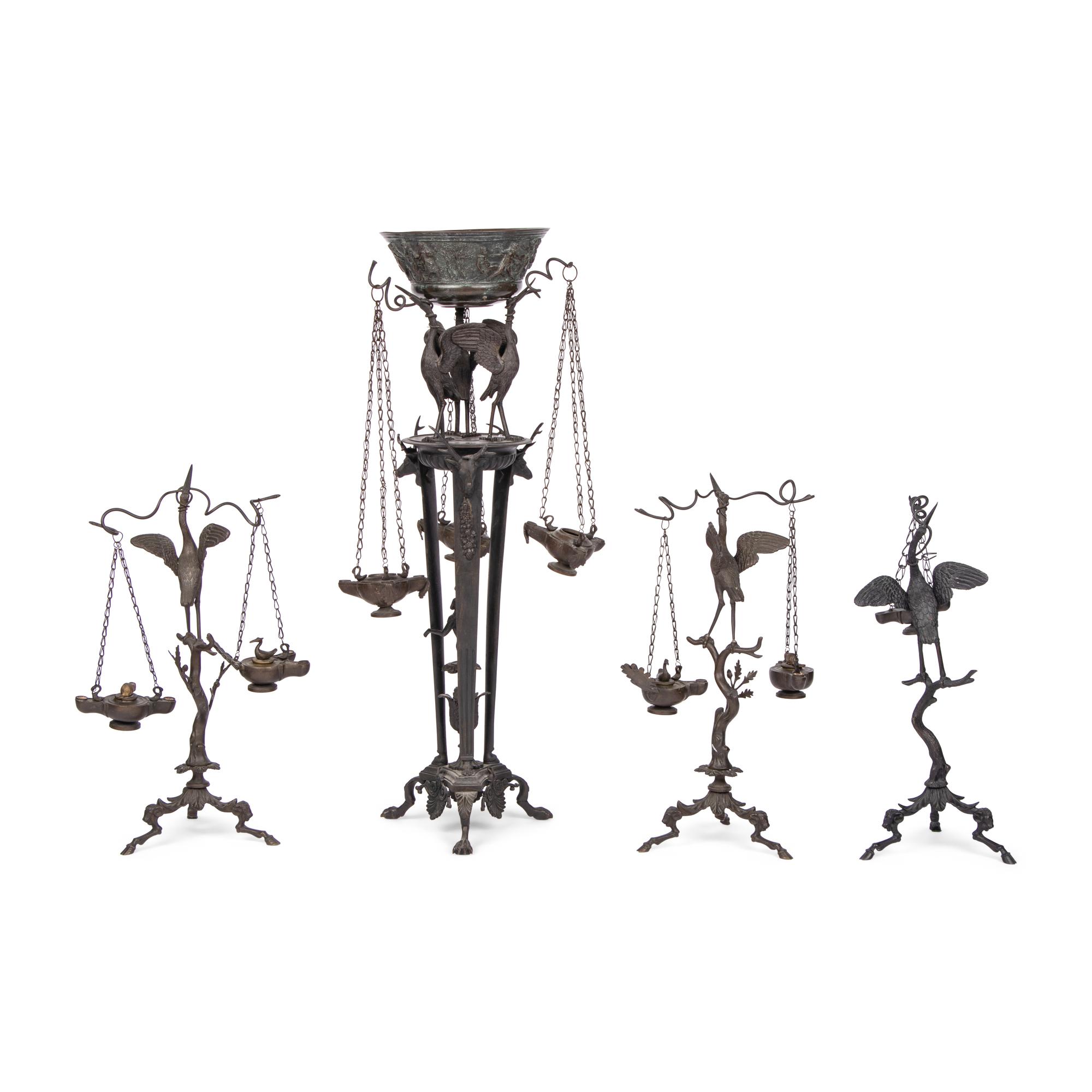 A Grand Tour Bronze Three-Piece Oil-Lamp Garniture