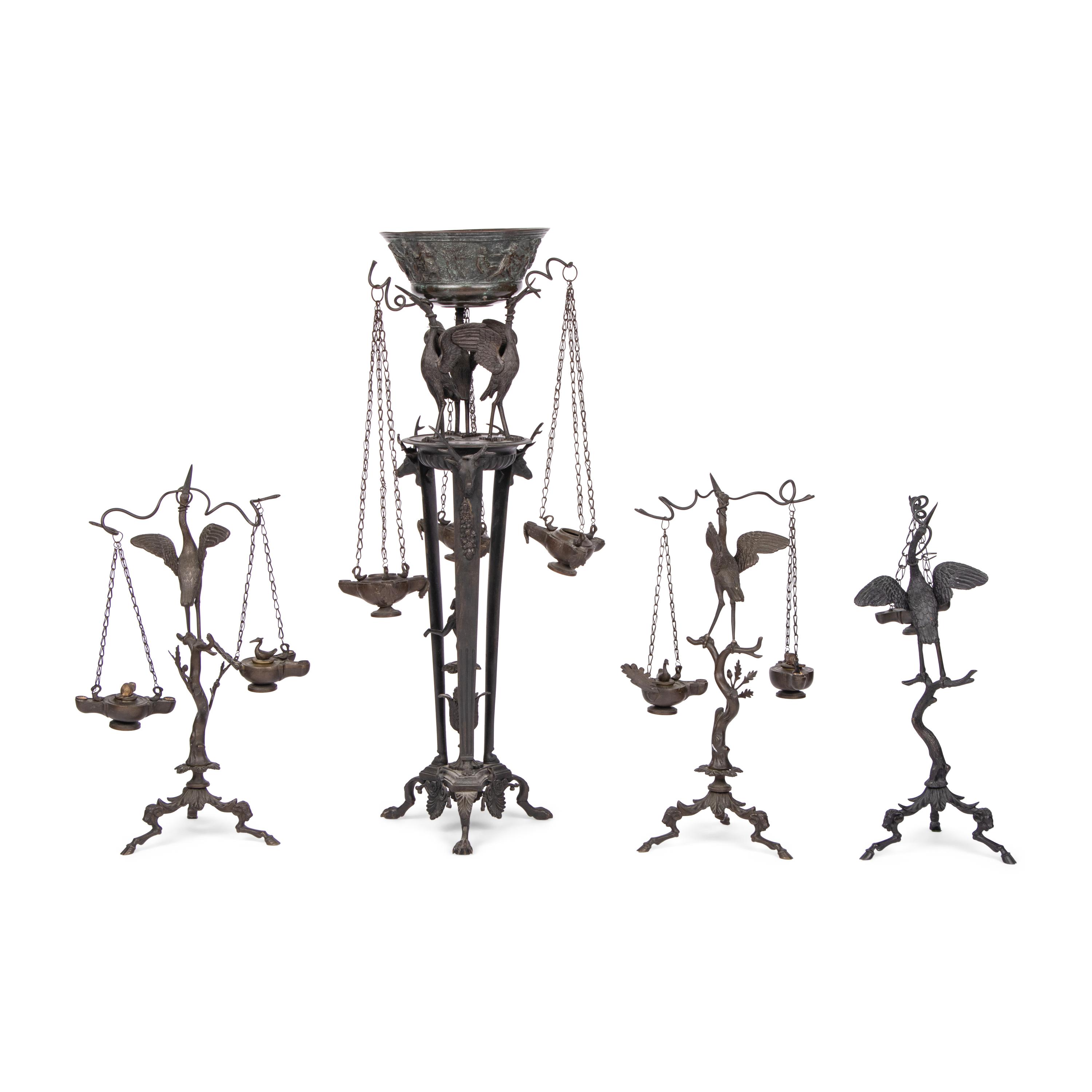 A Grand Tour Bronze Three-Piece Oil-Lamp Garniture