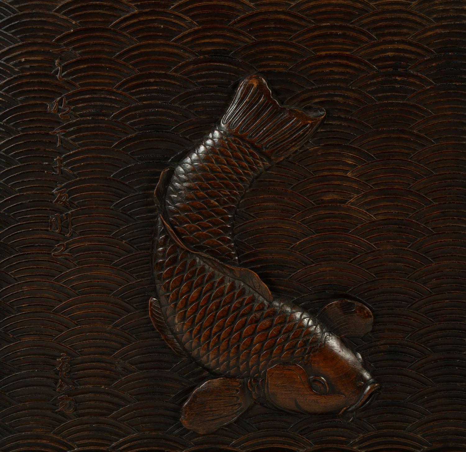 A Japanese Relief-Carved Walnut Panel Depicting a Carp — 19TH CENTURY