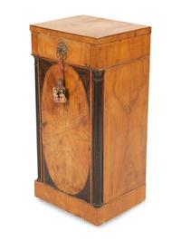 A Northern Italian Walnut and Ebonized Bedside Cabinet
