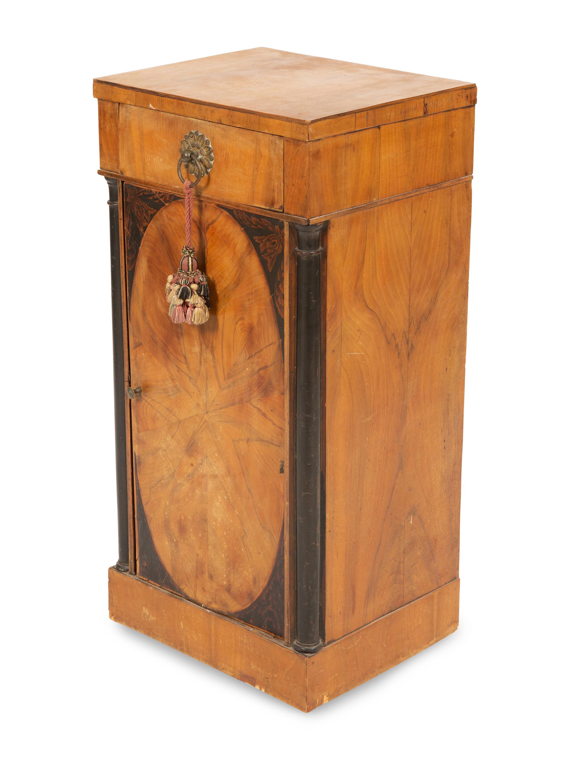A Northern Italian Walnut and Ebonized Bedside Cabinet