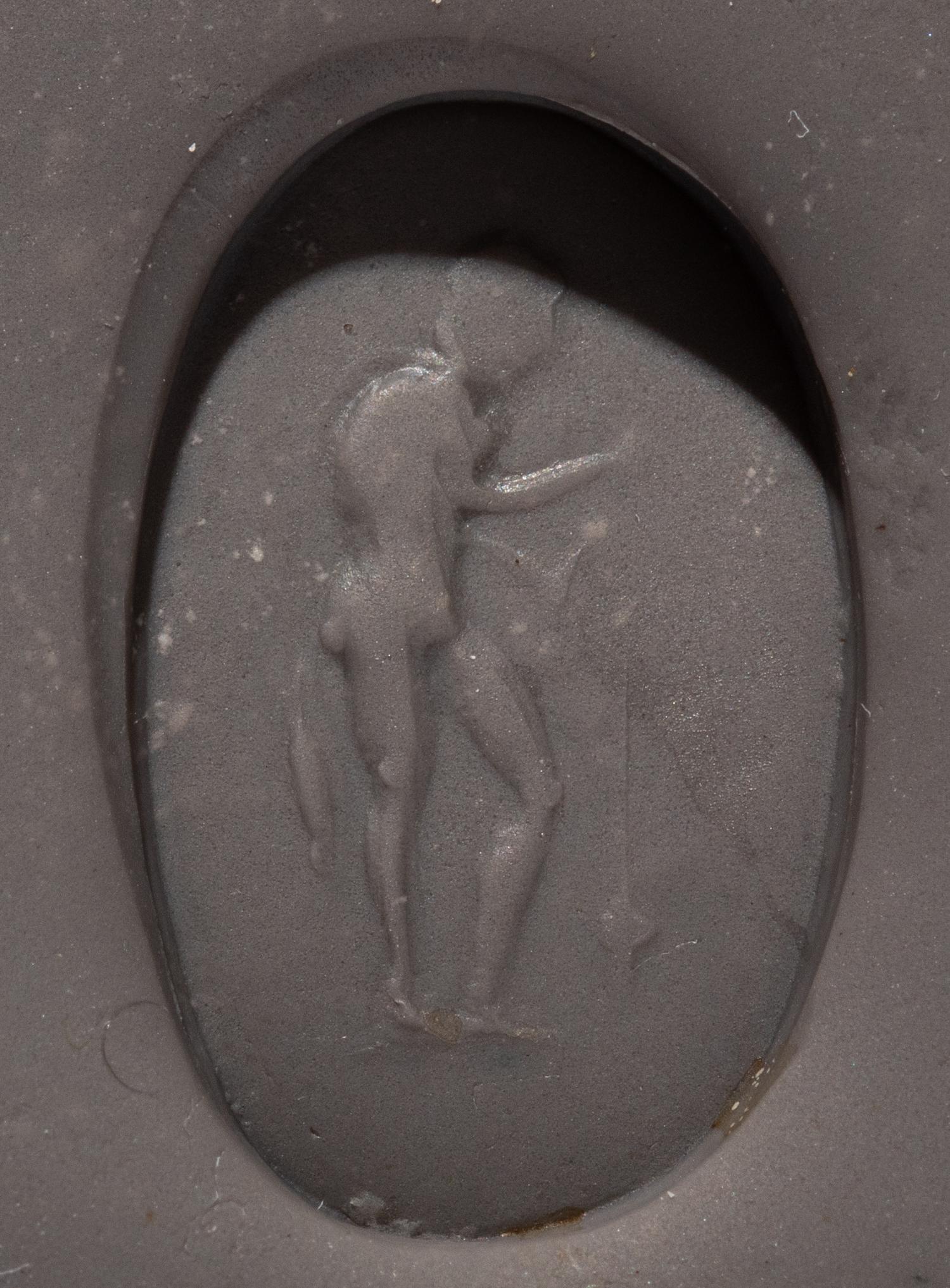 A Roman Banded Agate Ring Stone with a Fisherman and His Catch