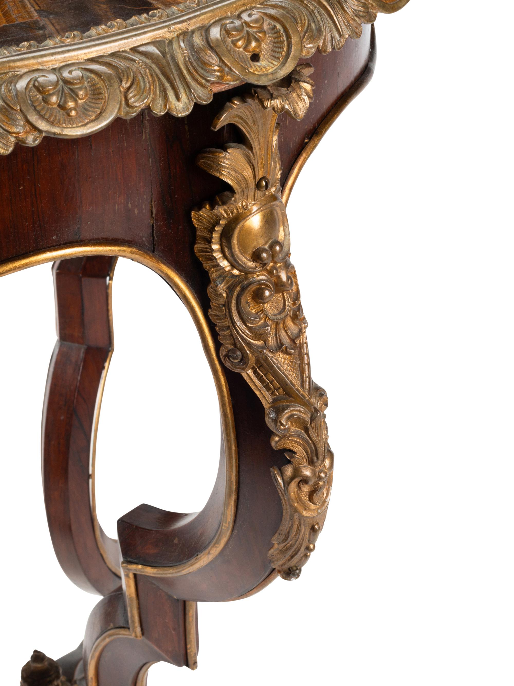 A Napoleon III Gilt Bronze and Inlaid Tiger's Eye Table