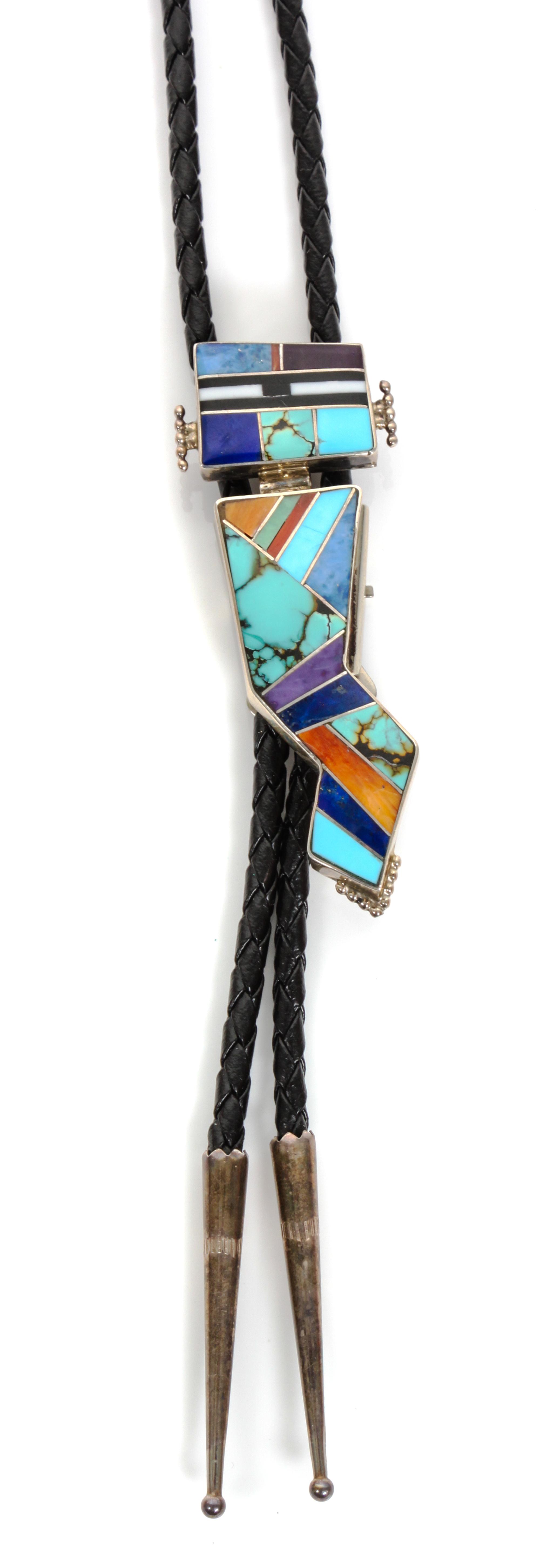 A Navajo Silver and Multiple Stone Mosaic Bolo, Yazzie Height 2 7/8 x width 1 1/8 inches.