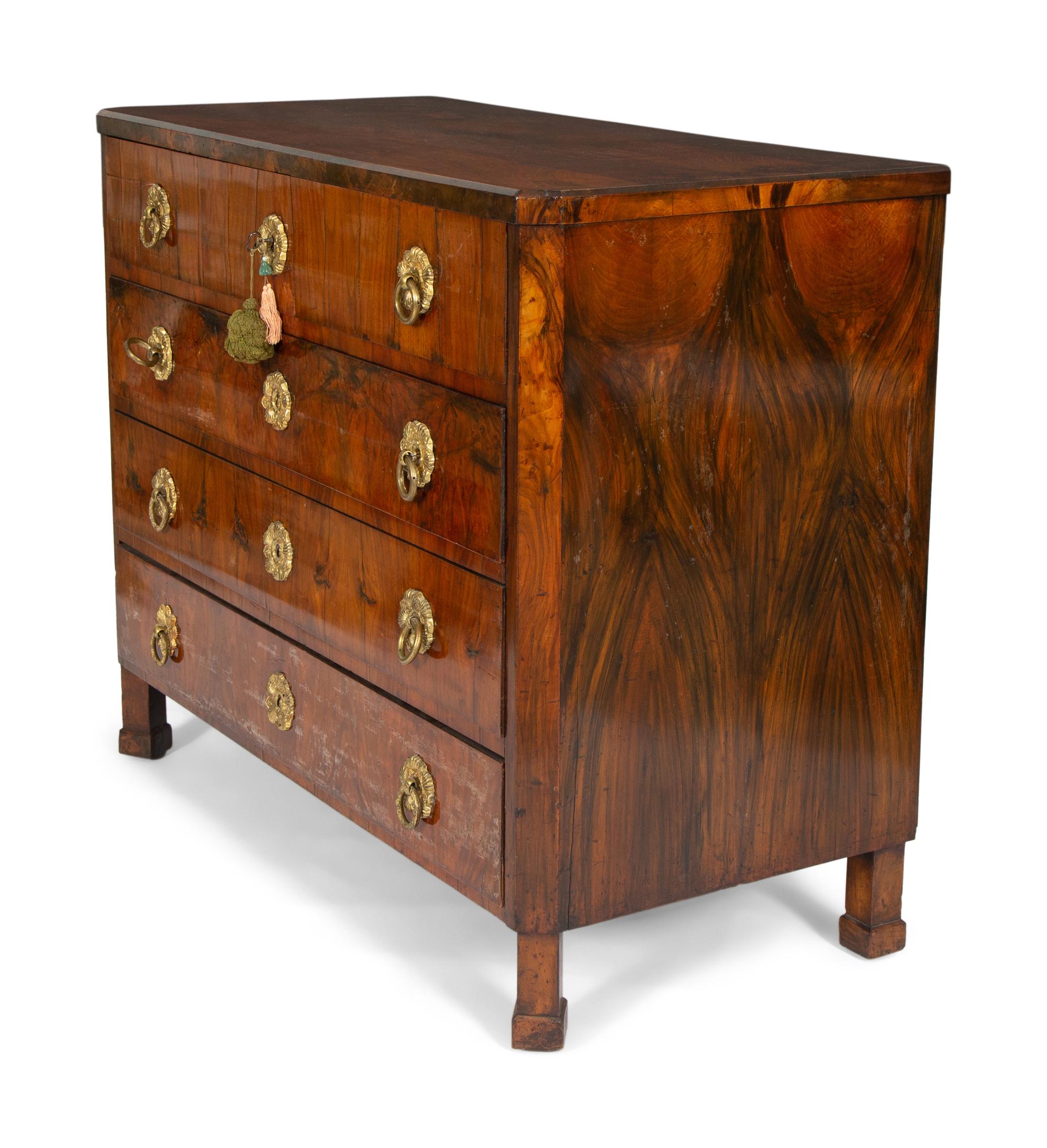 A Biedermeier Walnut Veneered and Grain-Painted Commode