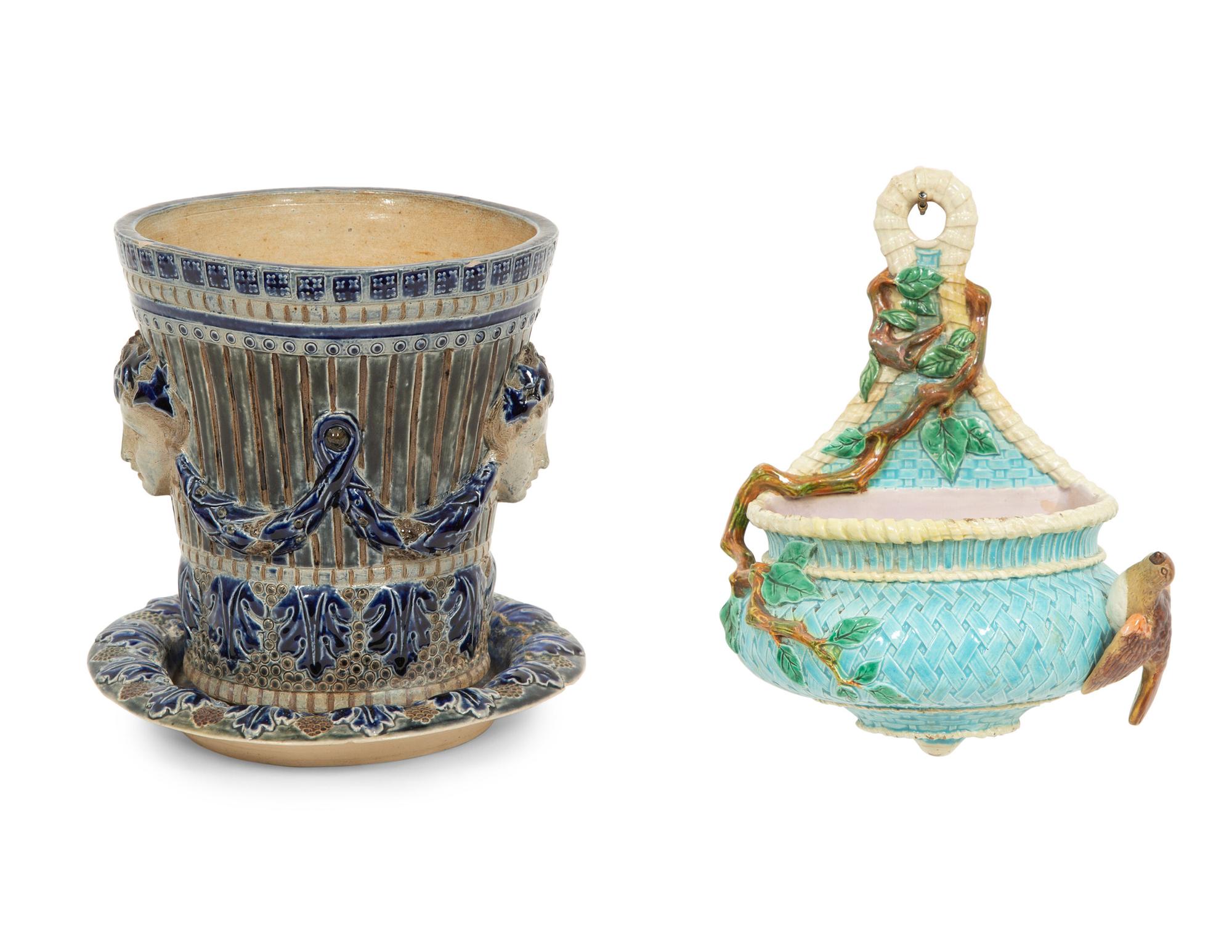 An English Majolica Jardiniere with Stand and a Cistern-form Wall Pocket