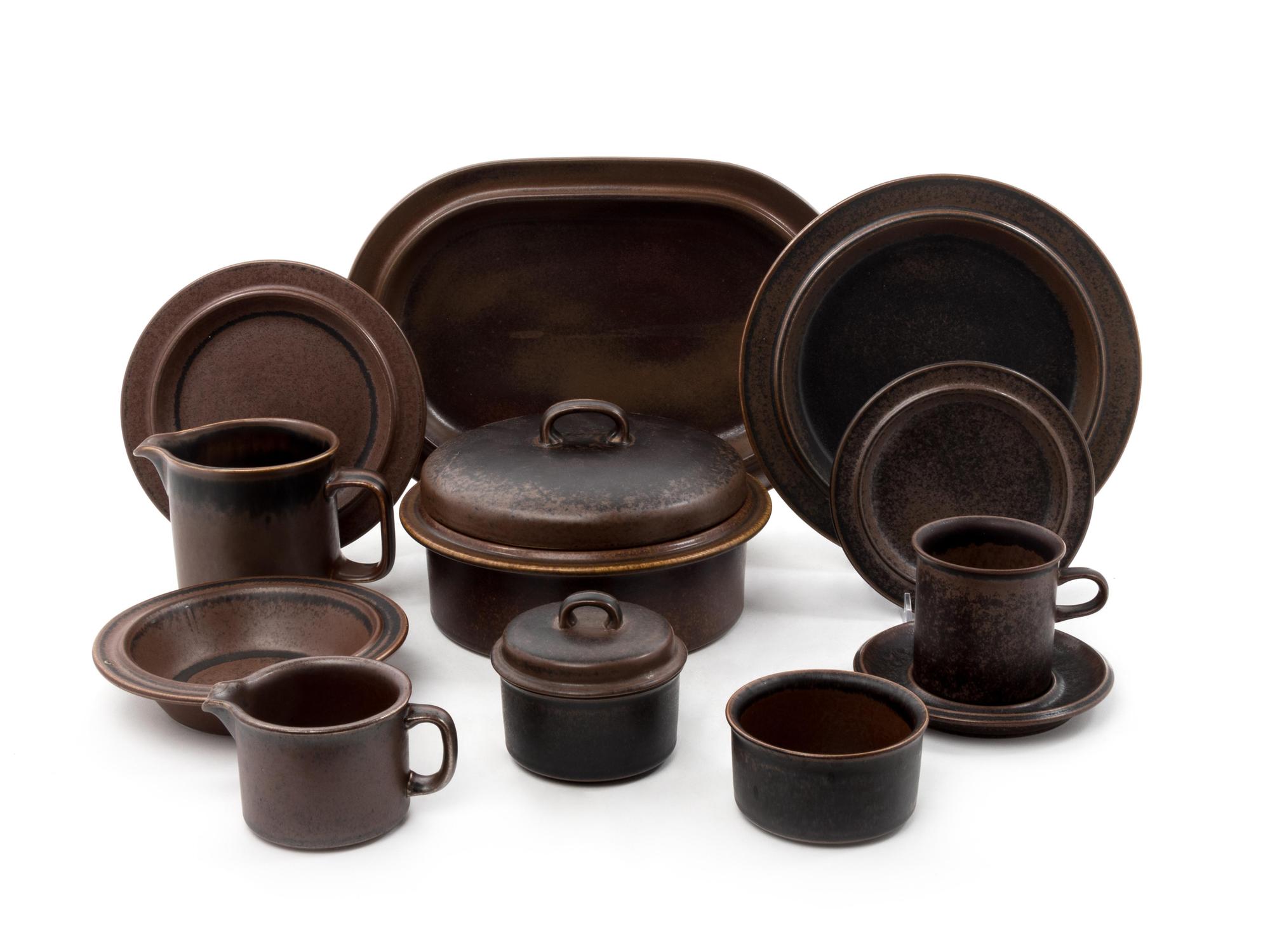 Ruska Dinnerware Set Comprising 14 Dinner Plates 11 Salad Plates 12 Desert Plates 10 Soup Bowls 10 Saucers 8 Coffee Mugs 1 Milk Pitcher 1 Lidded Tureen 1 Creamer 1 Lidded Sugar Bowl 1 Fish Platter Seventy Total Pieces Arabia, Finland glazed stoneware Length of longest 14 inches Seventy Total Pieces Arabia, Finland