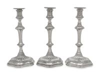 A Set of Three George III Silver Candlesticks