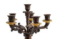 An Empire Style Gilt and Patinated Three-Piece Clock Garniture