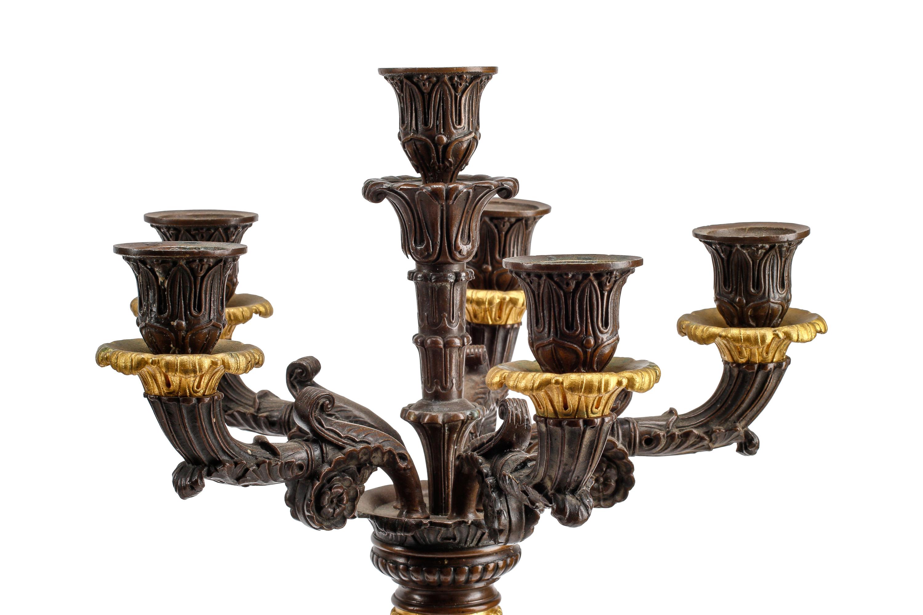 An Empire Style Gilt and Patinated Three-Piece Clock Garniture