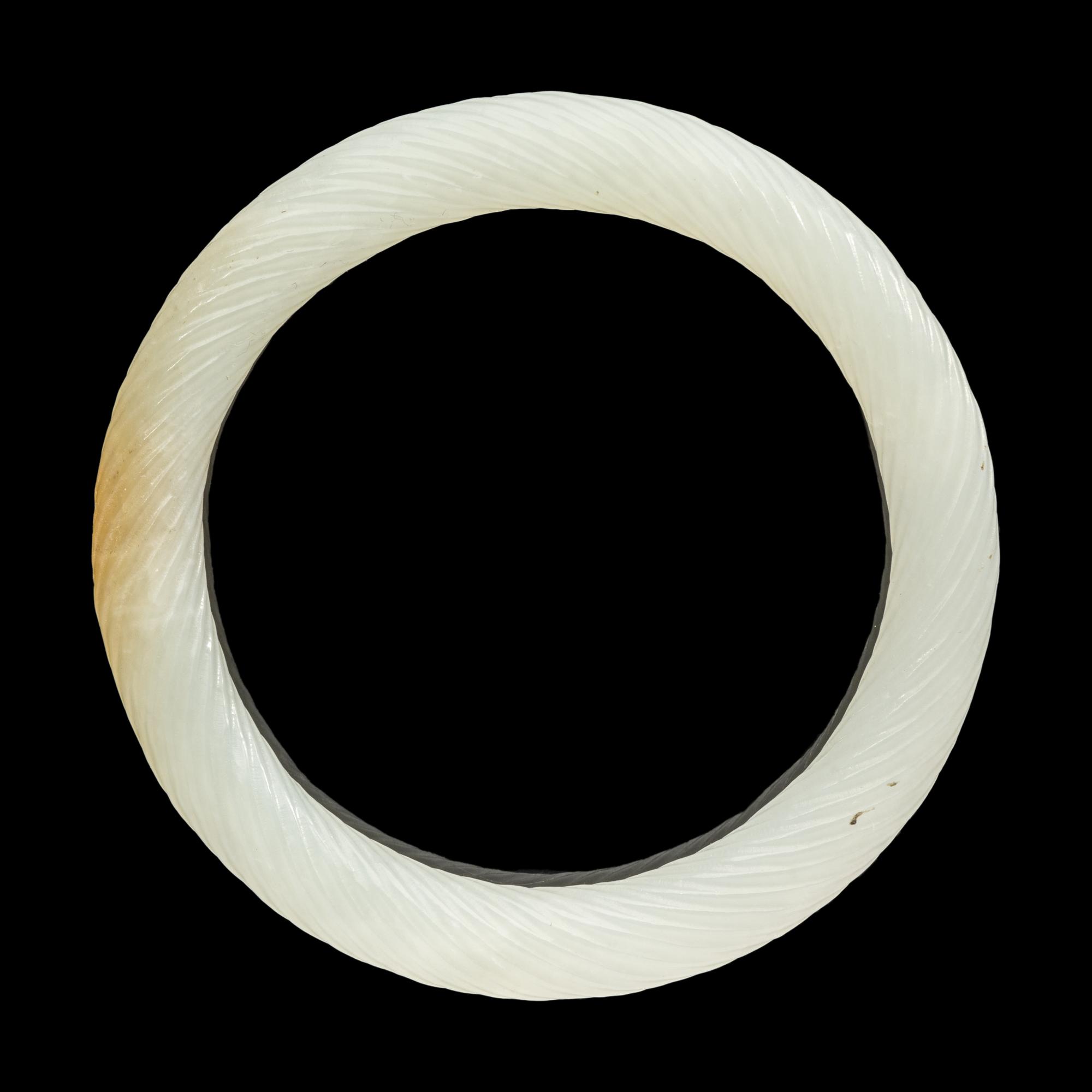 A Chinese Carved Jade Bangle
