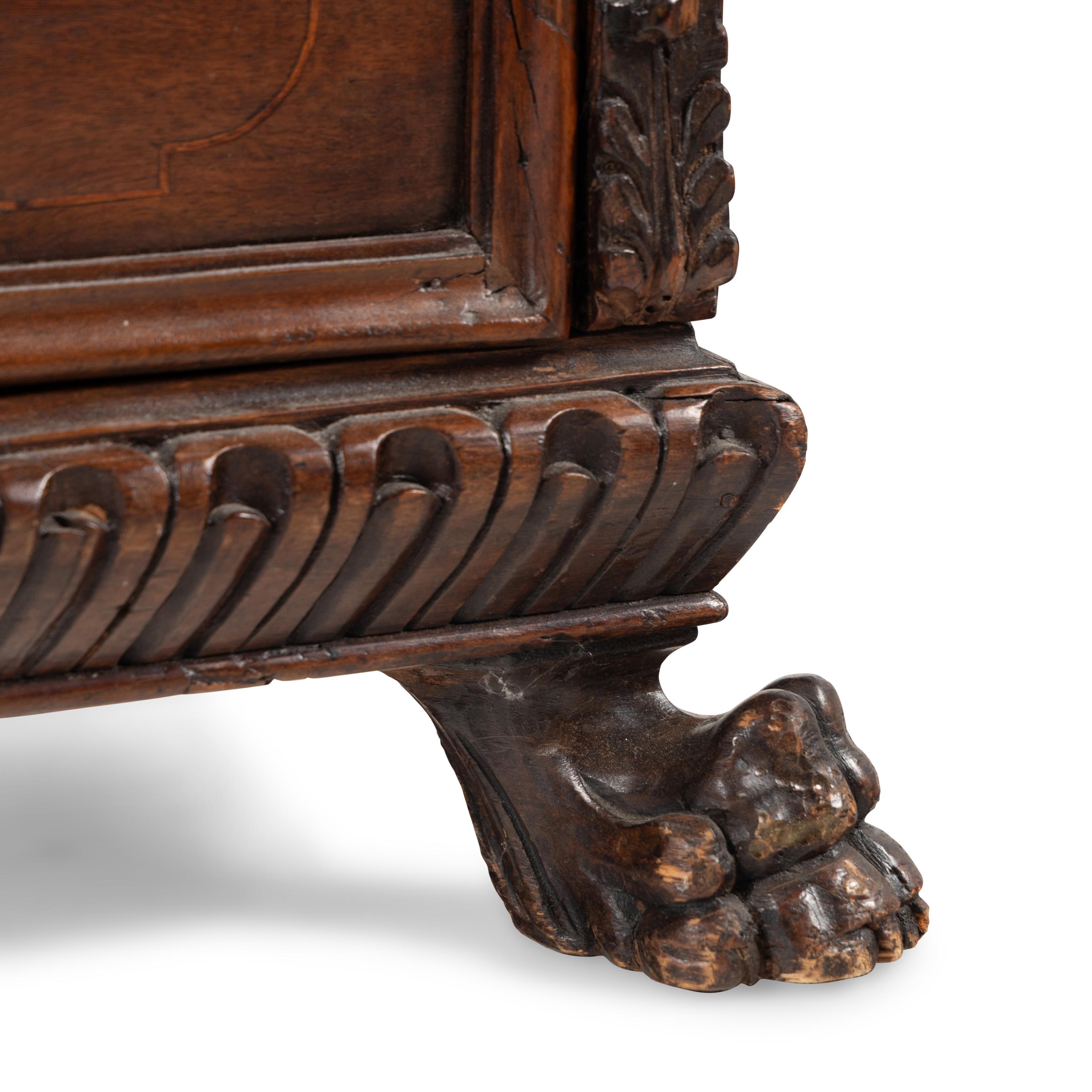 An Italian Baroque Walnut Chest of Drawers