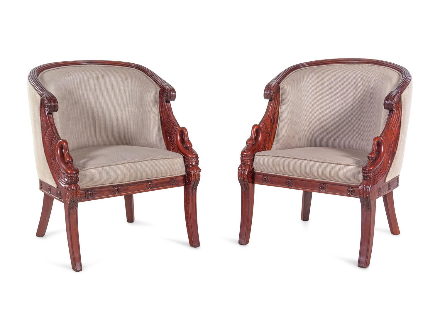 A Pair of Empire Style Carved Mahogany Swan's Neck Barrel Back Armchairs