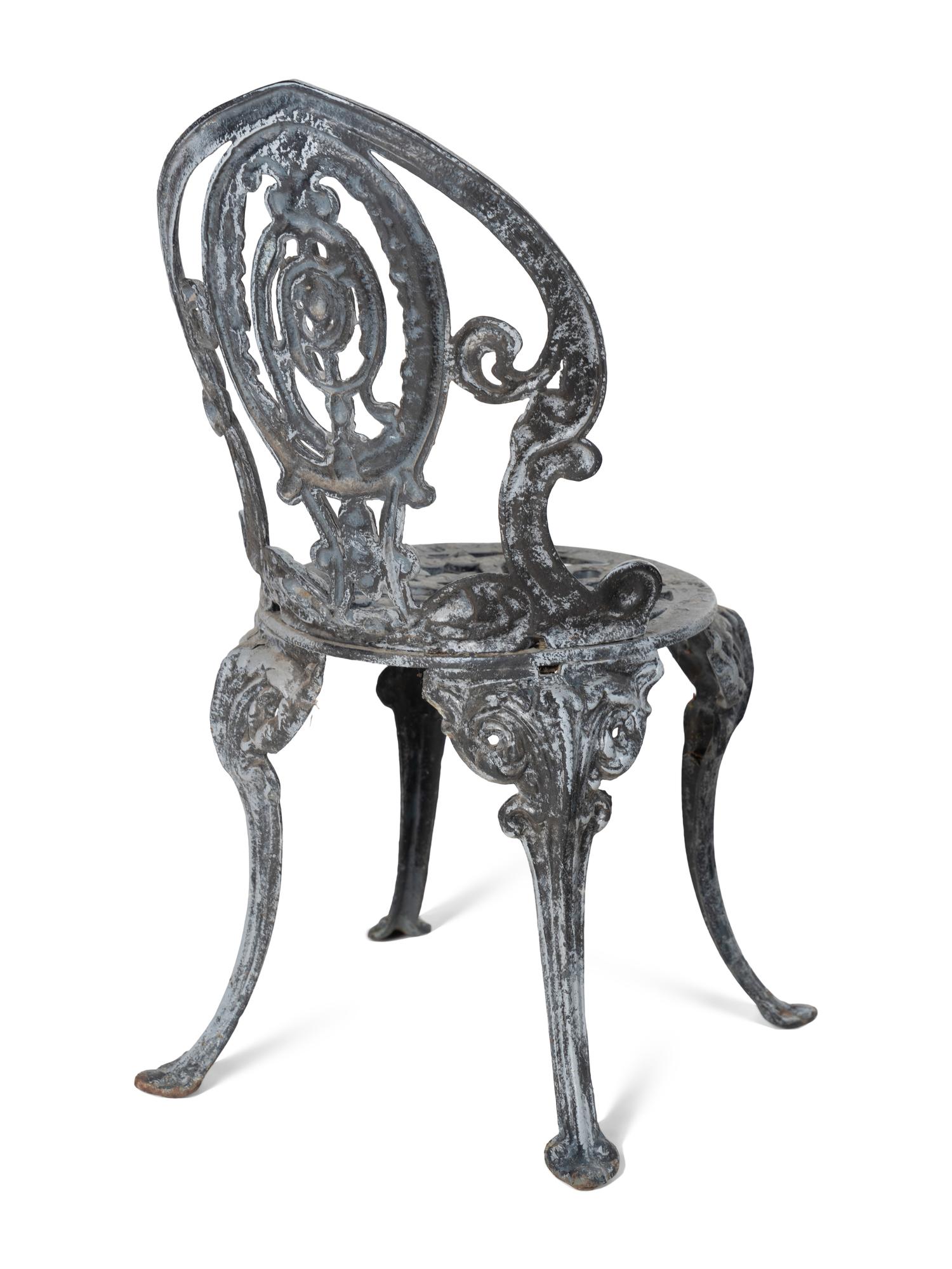 A Set of Four Wrought Iron Chairs