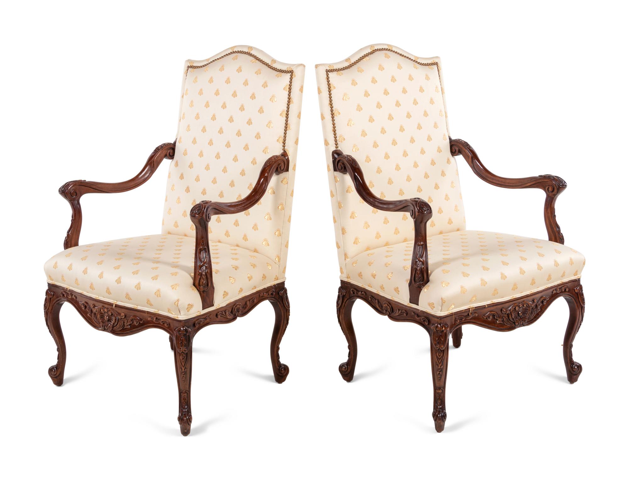 A Pair of Régence Style Walnut Armchairs