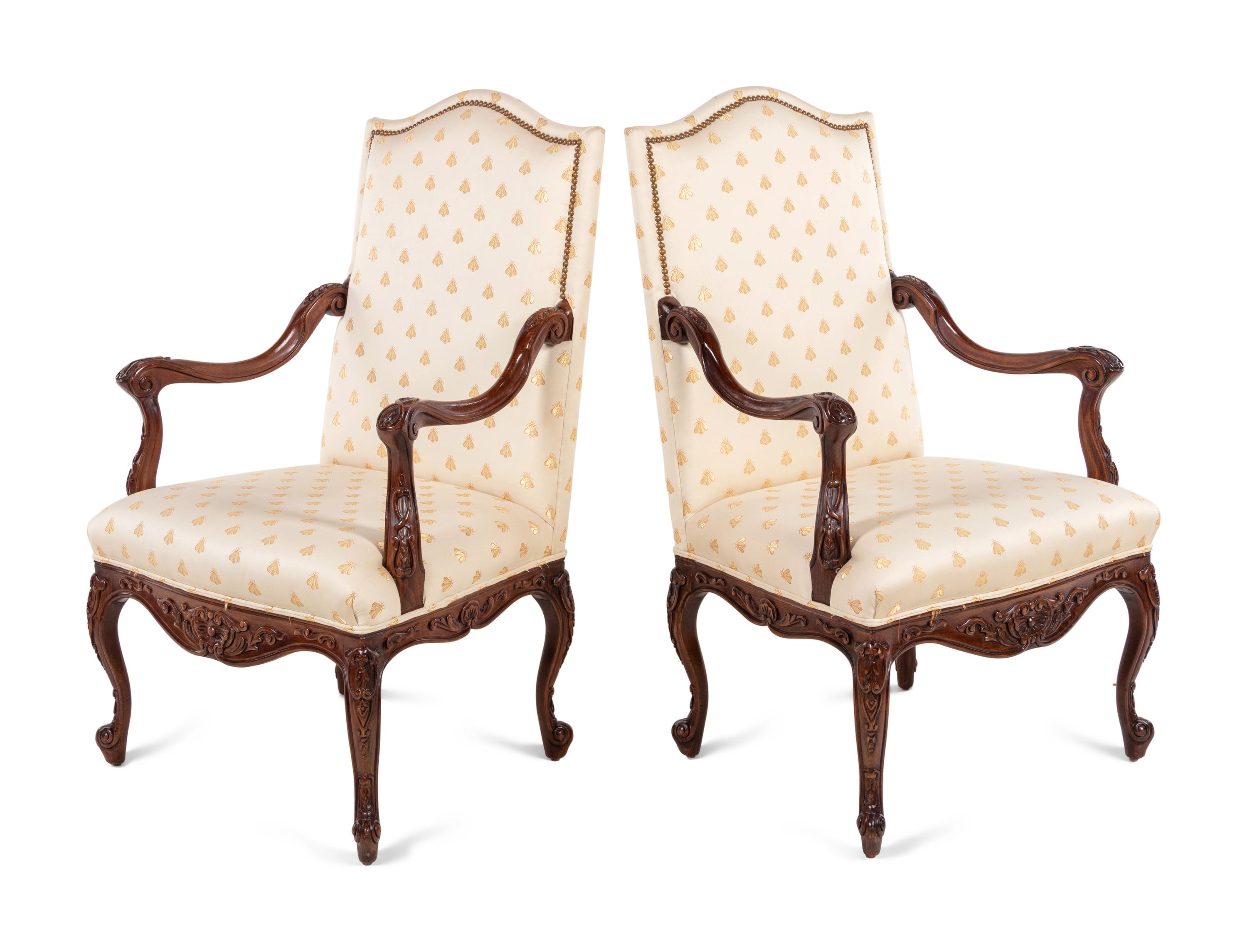 A Pair of Régence Style Walnut Armchairs