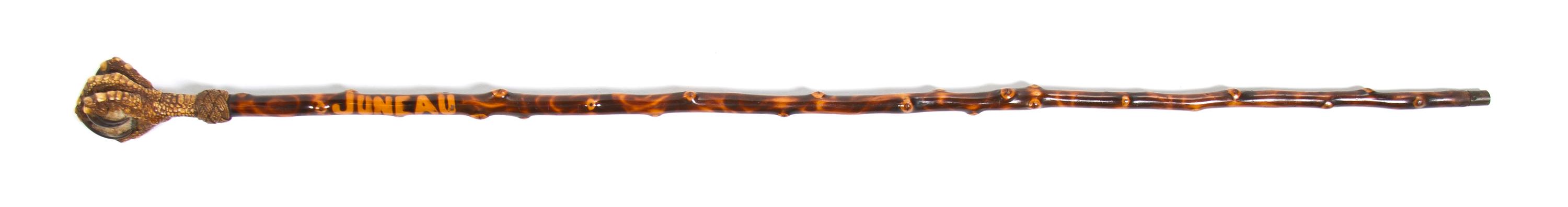 A Bird Talon and Exotic Wood Walking Stick, Height overall 35 x height of handle 2 7/8 inches.
