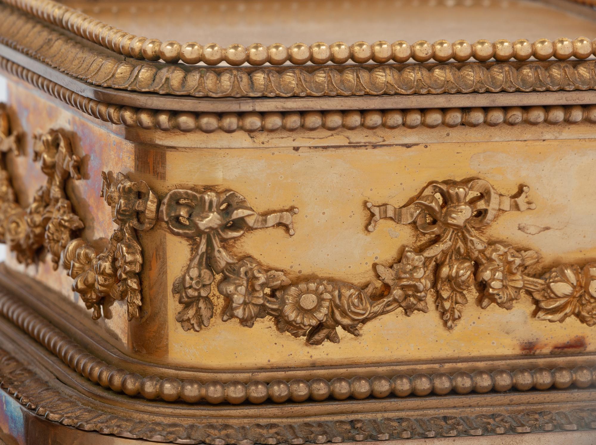 A Group of Three P.E. Guerin Gilt Bronze Garniture Stands