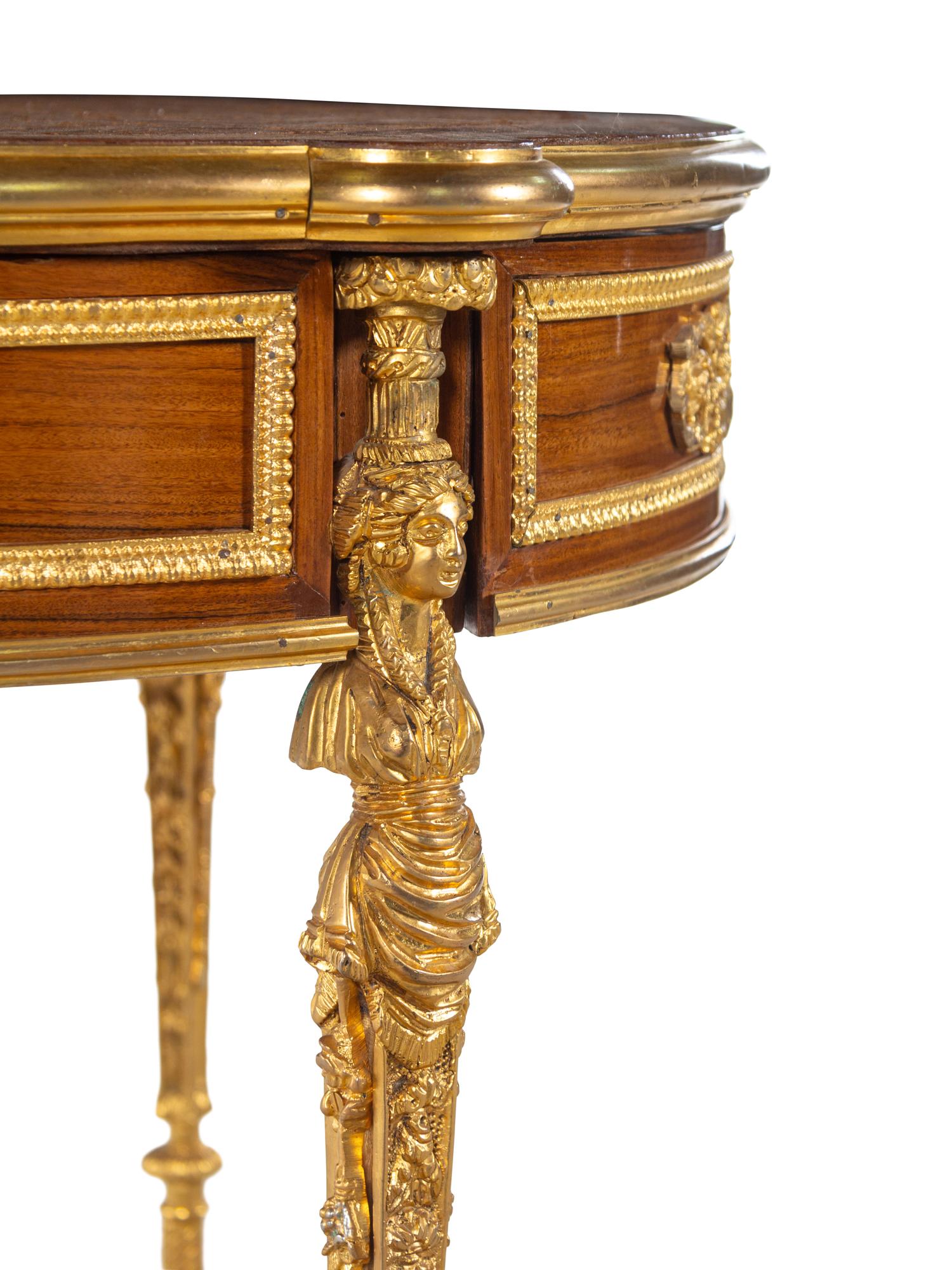 A Louis XVI Style Gilt Metal Mounted Parquetry Table