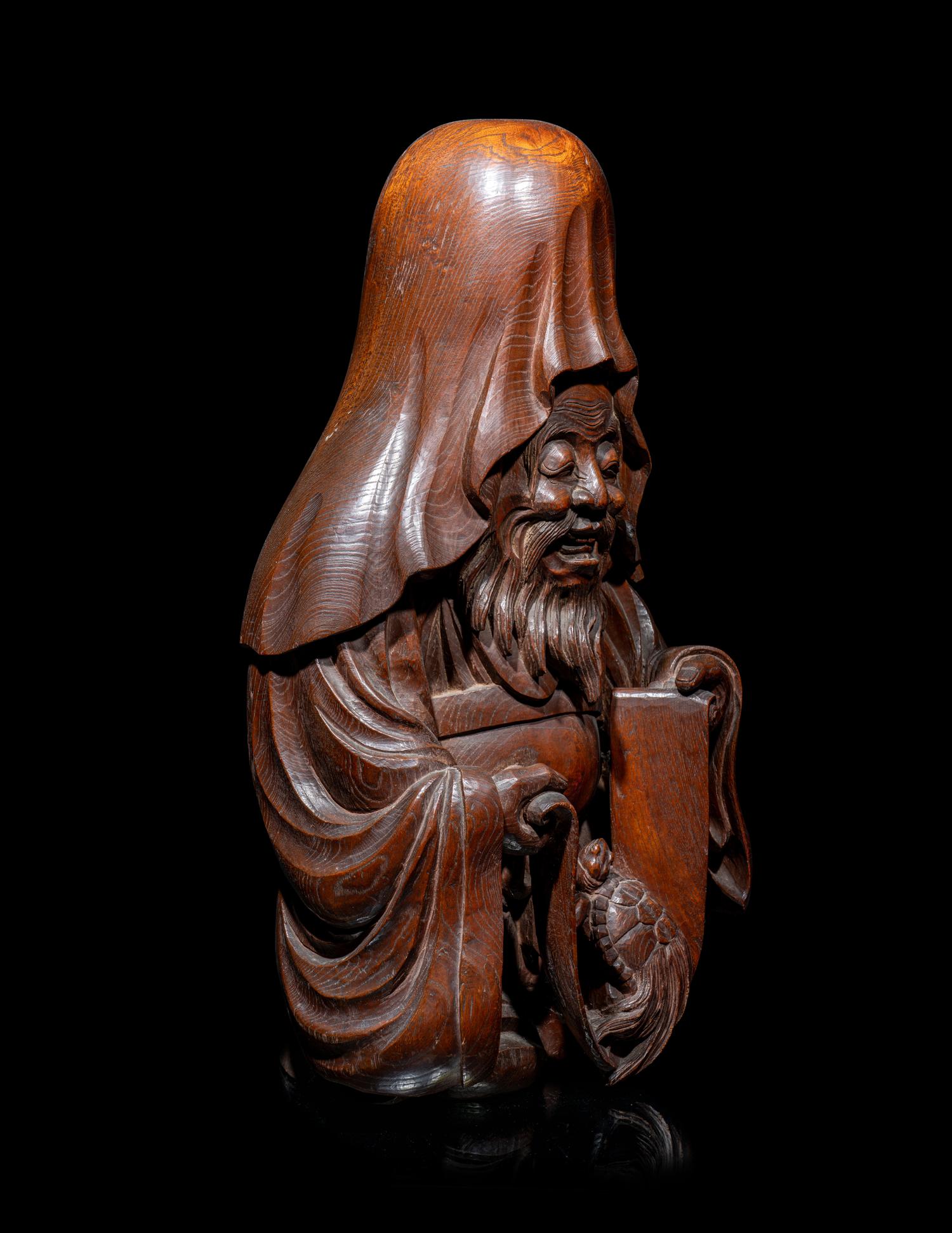 The Nagatani Trademark - A Japanese Carved Hardwood Figure of a Wise Man