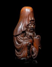 The Nagatani Trademark - A Japanese Carved Hardwood Figure of a Wise Man