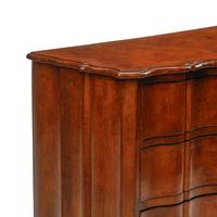 An Italian Walnut Serpentine-Front Chest of Drawers