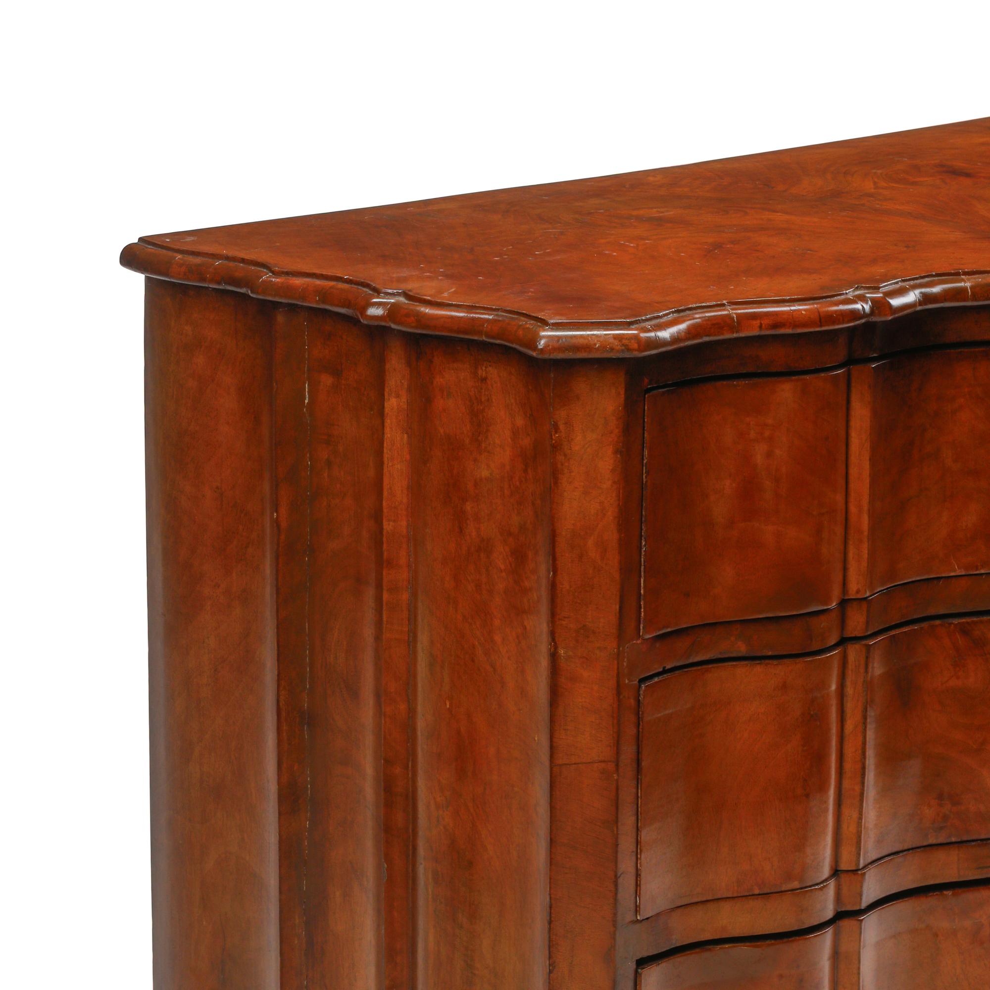 An Italian Walnut Serpentine-Front Chest of Drawers
