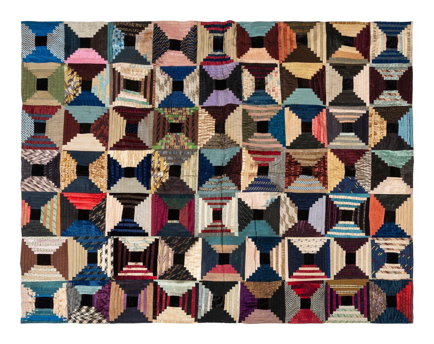A Pieced Silk 'Courthouse Steps' Pattern Quilt