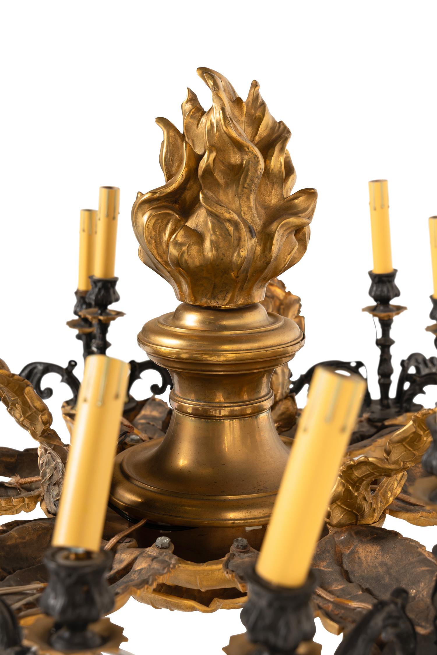 A French Gilt and Patinated Metal Twenty-Four Light Chandelier