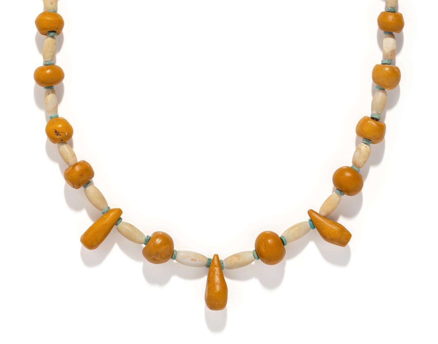 A Near Eastern Carnelian, Quartz, and Faience Bead Necklace