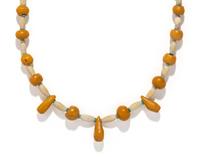 A Near Eastern Carnelian, Quartz, and Faience Bead Necklace