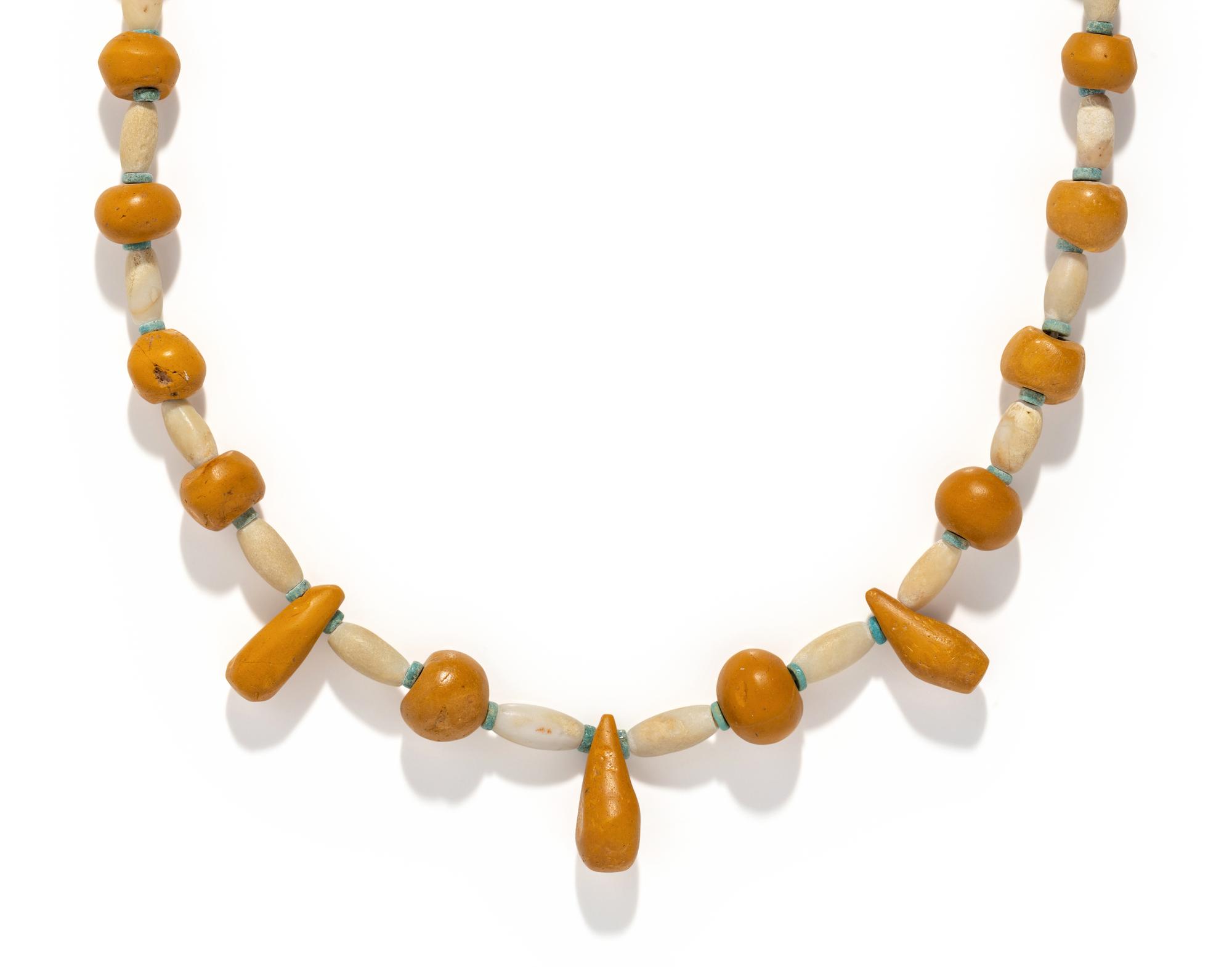 A Near Eastern Carnelian, Quartz, and Faience Bead Necklace