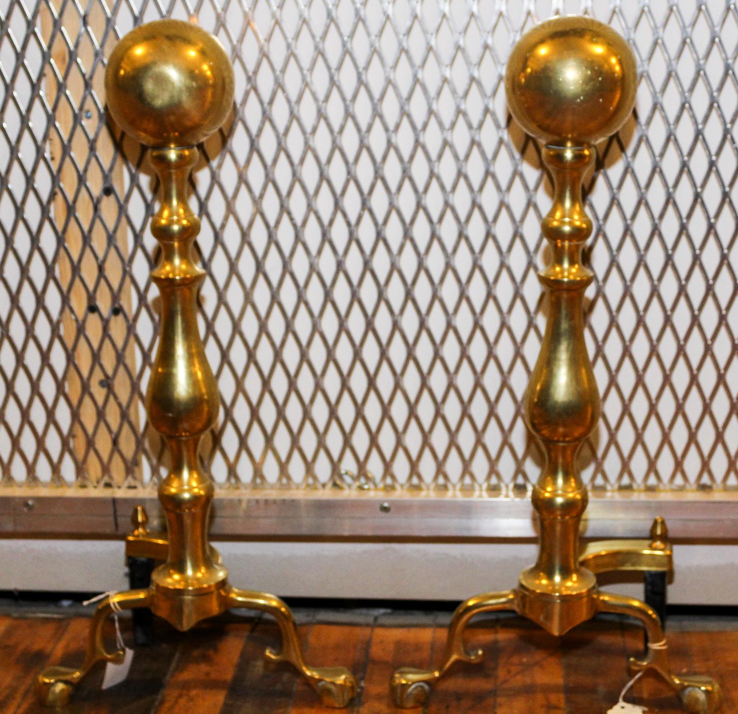 A Pair of American Brass Andirons Height 23 1/2 inches.